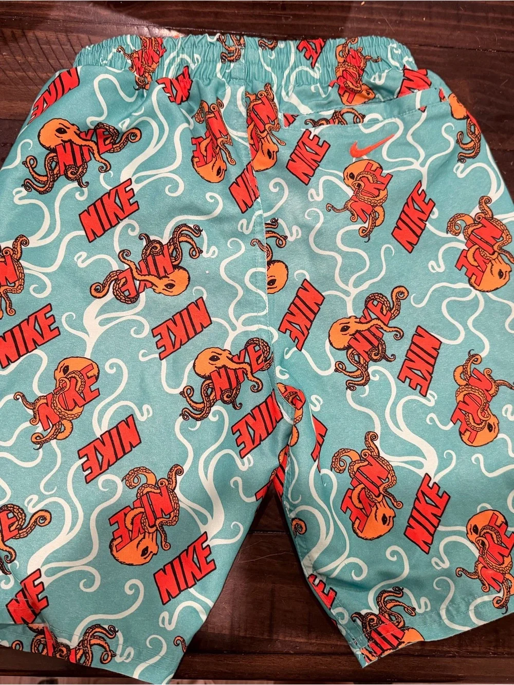 Nike Teal Swim Shorts with Orange Octopus Accent